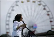  ?? AP PHOTO/JOHN LOCHER ?? Democratic presidenti­al candidate Sen. Kamala Harris, D-Calif., speaks at the Iowa State Fair on Saturday in Des Moines, Iowa.