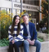  ?? RUTH FREMSON/THE NEW YORK TIMES ?? On Wednesday, Caroline Mullet sits with her father, Washington State Sen. Mark Mullet, outside Issaquah High School in Issaquah, Wash. Caroline, a ninth grader, prompted her father to work on a bill to ban AI-generated sexually explicit images of minors. The ban is set to take effect in June.