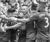  ?? REINHOLD MATAY/USA TODAY PHOTOS ?? Orlando City forward Dom Dwyer, far left, celebrates with teammates after scoring a goal during the first half.