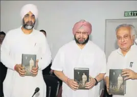  ??  ?? (From left) Punjab finance minister Manpreet Singh Badal and chief minister Captain Amarinder Singh with senior Congress leader and former Union minister Jairam Ramesh at the launch of the latter’s book in Chandigarh on Friday. HT PHOTO