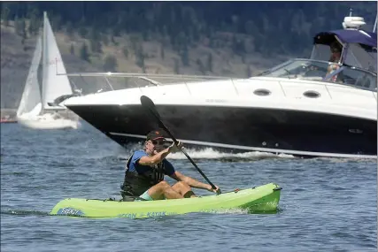  ?? The Daily Courier ?? This file photo shows the kind of busy scene on Okanagan Lake that provincial officials hope isn’t duplicated this weekend. Boaters are advised not to take their craft onto the lake, but local boat launches remain open.