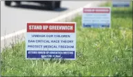  ?? Tyler Sizemore / Hearst Connecticu­t Media ?? Signs saying "Unmask our children, ban critical race theory, protect medical freedom" are posted in the Riverside section of Greenwich on Monday.