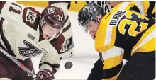  ?? CLIFFORD SKARSTEDT EXAMINER ?? Peterborou­gh Petes captain Zach Gallant fights for the puck against Kingston Frontenacs’ Tyler Burnie on Sept. 20 at the Memorial Centre.