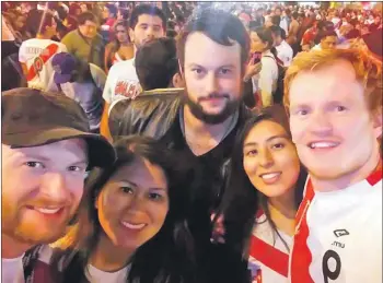  ??  ?? Michael Fee, farthest right, girlfriend Carla, second from right, and friends enjoy Peru’s World Cup party.