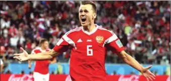  ??  ?? Denis Cheryshev celebrates the second goal for Russia against Egypt in 3-1 win last night at Saint Pertersbur­g.