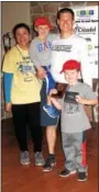  ?? SUBMITTED PHOTO ?? RSVP’s Run Wild Male Overall winner Derek Reinhold of North Wales, seen here with his children and Michele Moll, RSVP Executive Director, won with a time of 17:58.