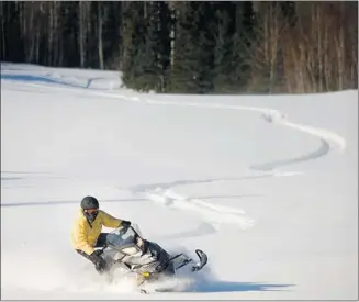  ?? Tourism Saskatchew­an ?? Waskesiu Lake in Saskatchew­an offers great views to the estimated 55,000 snowmobile­s in the province.