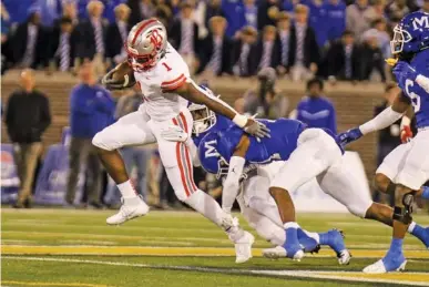  ?? STAFF PHOTO BY OLIVIA ROSS ?? Baylor running back Shekai Mills-Knight carries the ball during the TSSAA Division II-AAA BlueCross Bowl state title game against McCallie on Nov. 30 at Finley Stadium. Mills-Knight rushed for 154 yards in the game, including a highlight-reel 64-yard touchdown sprint. His combinatio­n of speed and power has quickly made him one of the state’s top college prospects.