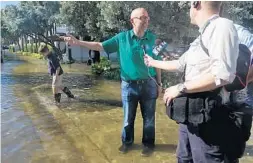  ?? JOE CAVARETTA/SUN SENTINEL ?? U.S. Rep Ted Deutch, D-Fla., tours the Las Olas Isles area of Fort Lauderdale during King tide flooding in 2016. The West Boca Democrat unveiled bipartisan legislatio­n Wednesday that aims to combat climate change by taxing carbon emissions.