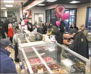  ??  ?? Many customers turn out for the opening of the “Next Generation” Dunkin’ in Milford Friday.