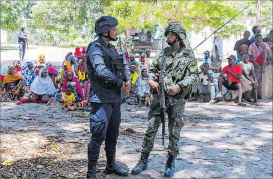  ?? Photo: Cyrile Ndegeya/getty Images ?? On guard: Rwandan Counter-terrorism Special Units and Mozambique police patrol streets in Palma as Rwanda provided military assistance after insurgents seized critical locations in the region that are rich in gas and valuable metals.