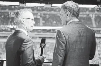  ?? FRANK FRANKLIN II THE ASSOCIATED PRESS ?? Troy Aikman, right, and Joe Buck before an NFL football game between the New York Giants and the Philadelph­ia Eagles on Oct. 11. The World Series comes in the midst of the busiest month of Buck’s 25-year career at Fox.