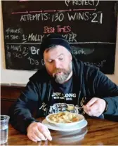  ?? PROVIDED PHOTO ?? Chicago bar owner Patrick Berger on Thursday enjoys a bowl of garlic soup — his first meal after a 40-day Lenten diet of mostly beer.