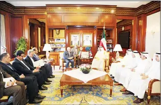  ?? KUNA photo ?? Kuwait’s FM Sheikh Sabah Al-Khaled receives his Iranian counterpar­t.