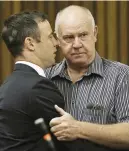  ?? Picture: AFP ?? CLOSE: Oscar Pistorius embraces coach Ampie Louw before his sentencing in 2014.