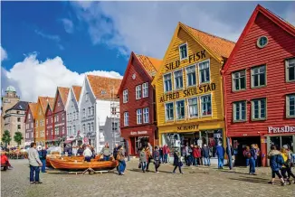  ??  ?? Norwegian wood: The streets of Bryggen in Bergen are a popular haunt