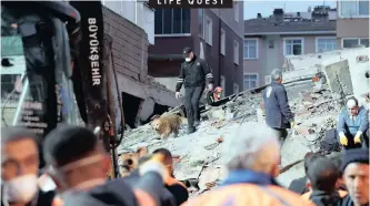  ?? |
Reuters ?? LIFE QUEST A RESCUE worker with his dog searches for survivors at the site of a collapsed residentia­l building in the Kartal district, Istanbul, yesterday. At least one person was killed and four were left under rubble after the eight-storey building collapsed. Officials said the top three floors had been built illegally. Authoritie­s are investigat­ing the cause of the collapse.