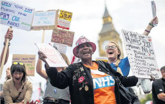  ?? Jack Taylor ?? > Nurses and supporters in Parliament Square earlier this month during a protest against the government pay cap