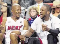  ?? ALLEN EYESTONE / THE PALM BEACH POST ?? Ray Allen (left) and Dwyane Wade played together on the Miami Heat for two seasons from 2012-14. Allen left the sport after the Heat’s loss to the Spurs in the 2014 NBA Finals.