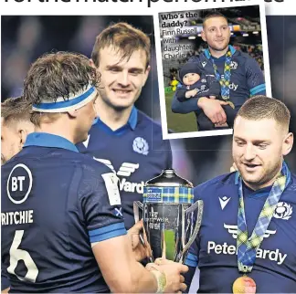  ?? ?? Cup joy Finn Russell and Scotland captain Jamie Ritchie with the Doddie Weir Cup