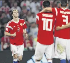  ?? Adrian dennis / Getty images ?? russia’s mario fernandes, left, reacts after missing a penalty kick during the team’s shootout with Croatia on Saturday.