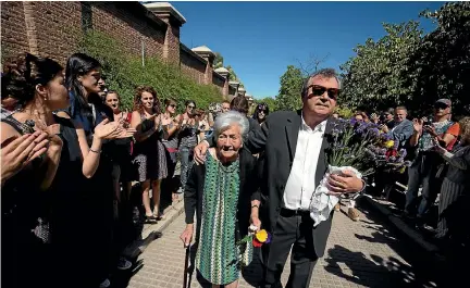  ?? PHOTO: REUTERS ?? Ascension Mendieta, daughter of Timoteo Mendieta, who was shot in 1939 by forces of dictator Francisco Franco, arrives with her son Francisco to the burial of her father in Madrid after he was exhumed from a mass grave in Guadalajar­a.