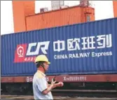  ?? ZOU HONG / CHINA DAILY ?? A railway employee supervises a freight train from Europe to China under the China Sino Euro Cargo Railway program.