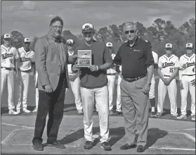  ?? Terrance Armstard/News-Times ?? Donations: El Dorado baseball coach Cannon Lester, center, presents to Southern Bancorp president Scott Fife and Bob Risor a plaque of recognitio­n for sponsoring the team's new scoreboard along with Murphy USA.