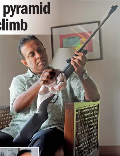 ??  ?? Preparing to take a pot shot at the authoritie­s? Rukshan is an air rifle enthusiast. Pix By Amila Gamage
