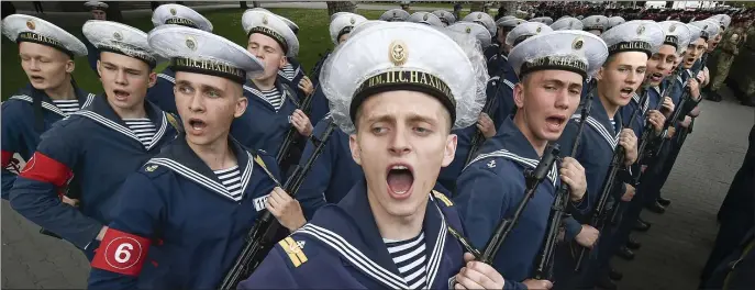  ?? AP ?? DRY RUN: Russian navy cadets answer a greeting at a rehearsal for the Victory Day military parade in Sevastopol, Crimea, on Thursday. The parade will take place in Sevastopol on May 9 to celebrate the 77th anniversar­y of victory in World War II.