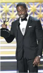  ?? CHRIS PIZZELLO/THE ASSOCIATED PRESS ?? Sterling K. Brown accepts the award for outstandin­g lead actor in a drama series for This Is Us