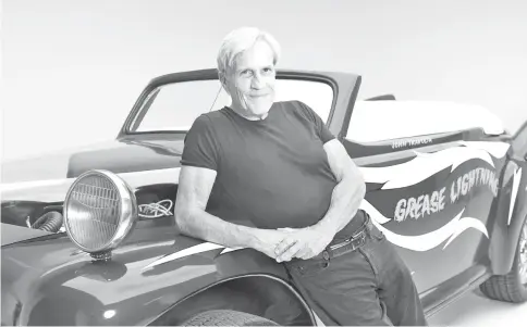  ??  ?? US director Randal Kleiser poses during a photo session for AFP with the “Grease Lightning” car, for the 40th anniversar­y of the movie, at the Petersen Automotive Museum in Los Angeles. — AFP photo