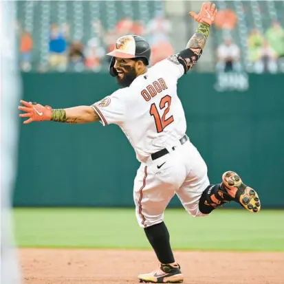  ?? TERRANCE WILLIAMS/AP ?? Orioles second baseman Rougned Odor celebrates after his fielder’s choice plated Adley Rutschman in the bottom of the 11th inning for a 7-6 win over the Rays in Baltimore on Sunday.
