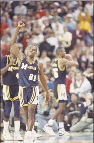  ?? Associated Press ?? In this April 4, 1989, file photo, Michigan’s Rumeal Robinson celebrates making the first of two free throws with three seconds remaining in overtime against Seton Hall in the NCAA championsh­ip game in Seattle.