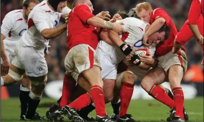  ?? Photograph: Tom Jenkins/The Guardian ?? Former England rugby player Steve Thompson, who has revealed that he has early-onset dementia, is tackled during a six nations game against Wales.