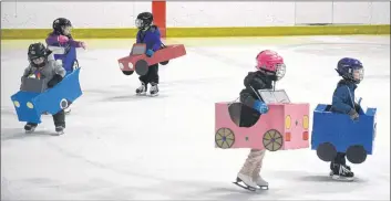  ?? KIRK STARRATT ?? As part of the Fabulous 50’s Ice Show’s “Friday Night at the Drive-in” number, these young skaters played cars.