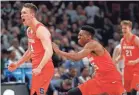  ?? RICK OSENTOSKI/USA TODAY SPORTS ?? Braedon Bayer (14) and the Syracuse Orange are headed to the Sweet 16 despite entering the NCAA tournament as one of the final teams selected.