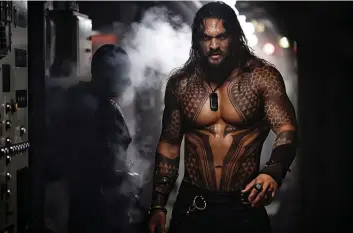  ?? WARNER BROS. ?? “People want more,” Aquaman star Jason Momoa says of superhero movies. “When Batman v Superman came out and it introduced Wonder Woman, she came in and blew it open.”