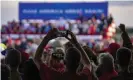  ?? Photograph: Dominick Sokotoff/Rex/Shuttersto­ck ?? A supporter takes a picture at Trump’s campaign rally.