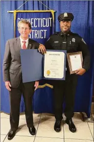  ?? Contribute­d photo ?? Shelton Police Officer John Staples was named Officer of the Year by the Shelton Exchange Club on Friday at the Aqua Turf in Plantsvill­e.