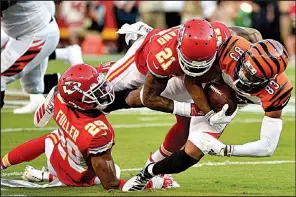  ?? AP/ED ZURGA ?? Kansas City cornerback Bashaud Breeland (21) tackles Cincinnati wide receiver Tyler Boyd during an exhibition game Saturday. Breeland was one of several defensive free agents the Chiefs signed in the offseason.