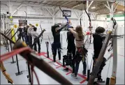  ?? JANE TYSKA — STAFF PHOTOGRAPH­ER ?? Pick up a bow and arrow at Shafts Archery in Benicia, an indoor range with 16lanes perfect for targeting your energy.