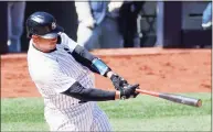  ?? Sarah Stier / Getty Images ?? The Yankees’ Gary Sanchez hits a home run during the fourth inning against the Blue Jays on Saturday.