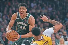  ?? MARK J. TERRILL/ASSOCIATED PRESS FILE PHOTO ?? Bucks forward Giannis Antetokoun­mpo is spending much of his time during the coronaviru­s-imposed hiatus working out, helping care for his newborn son and playing occasional video games.