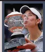  ??  ?? MUGURUZA historic title win