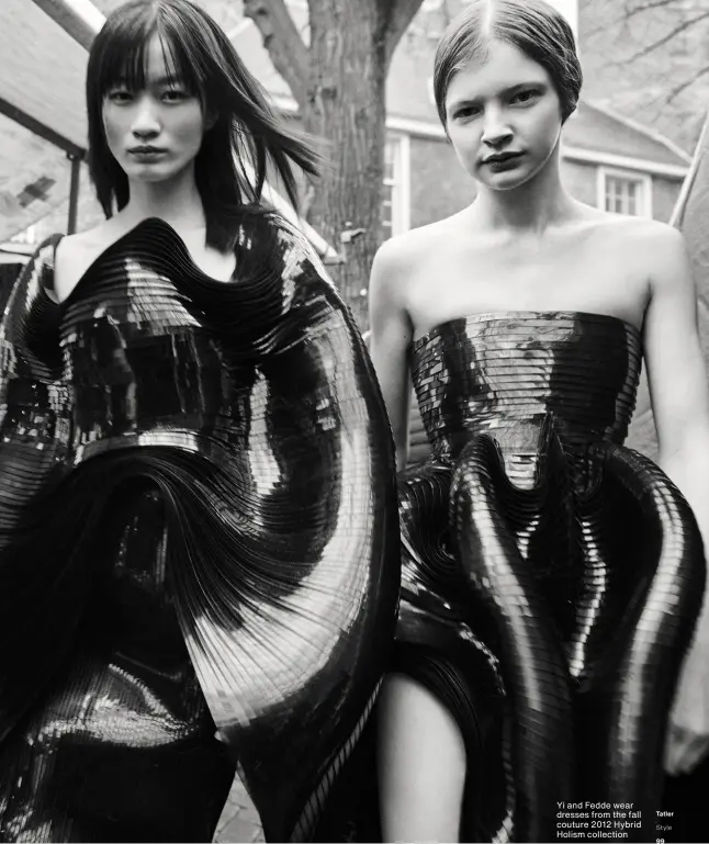  ??  ?? Yi and Fedde wear dresses from the fall couture 2012 Hybrid Holism collection