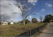  ??  ?? Empty lots where houses once stood line a nearly abandoned street in the Oakwood Beach neighborho­od of Staten Island, in New York, four years after Superstorm Sandy’s deadly storm surge ravaged the area.