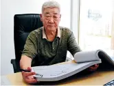  ??  ?? Xu Baoming, former chief of the water supply and drainage design department of Jiading Tap Water Co, is a living witness to Jiading’s drinking water supply history. — Wang Lihui