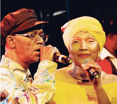  ?? PHOTOS BY KENYON HEMANS ?? Beres Hammond (left) and Marcia Griffiths singing at Saturday night’s Final Chapter of the Startime concert series, held at Mas Camp, National Stadium, St Andrew.