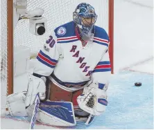  ?? AP PHOTO ?? DANG IT: Rangers goaltender Henrik Lundqvist reacts as the puck bounces out of the net after a goal by Montreal’s Alexei Emelin during the third period last night.